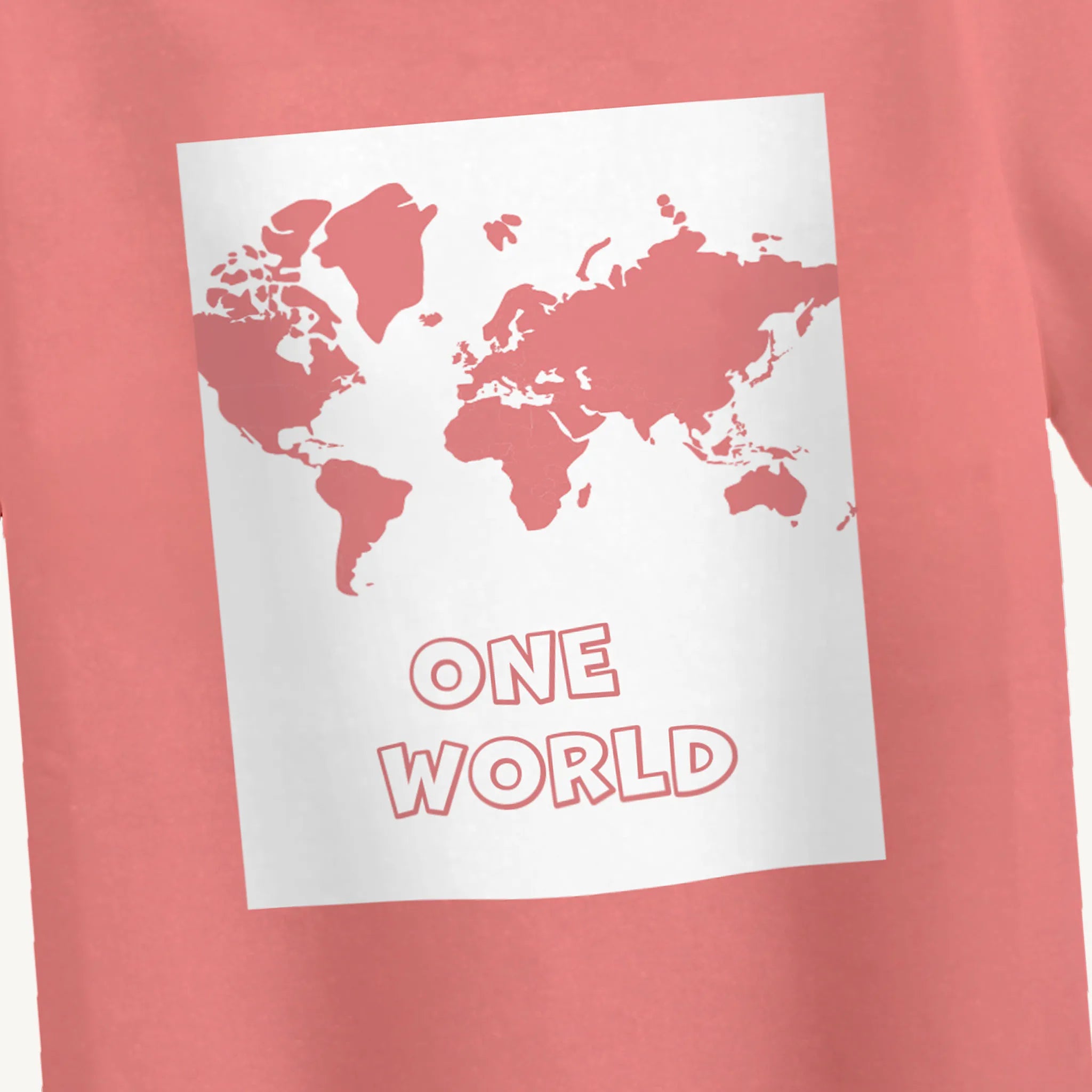 Closeup of world map design on boys' peach One World print T-shirt, perfect for ages 4-12 years.